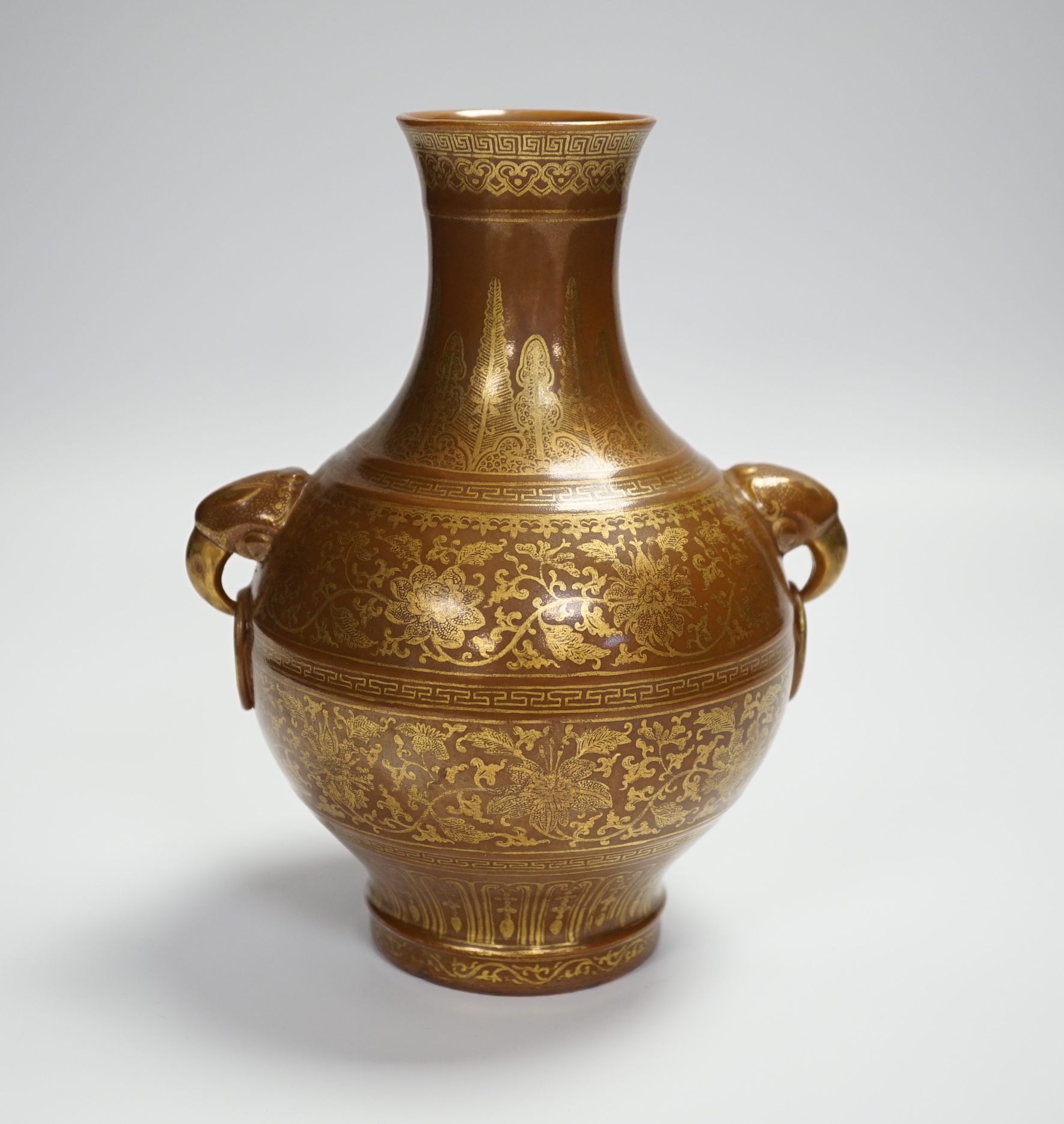 A Chinese porcelain imitation bronze vase, on a brown ground with gilt decoration, 19.5cm high